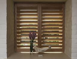 Luxury Custom Hardwood Window Shutters with Warm Timber Finish